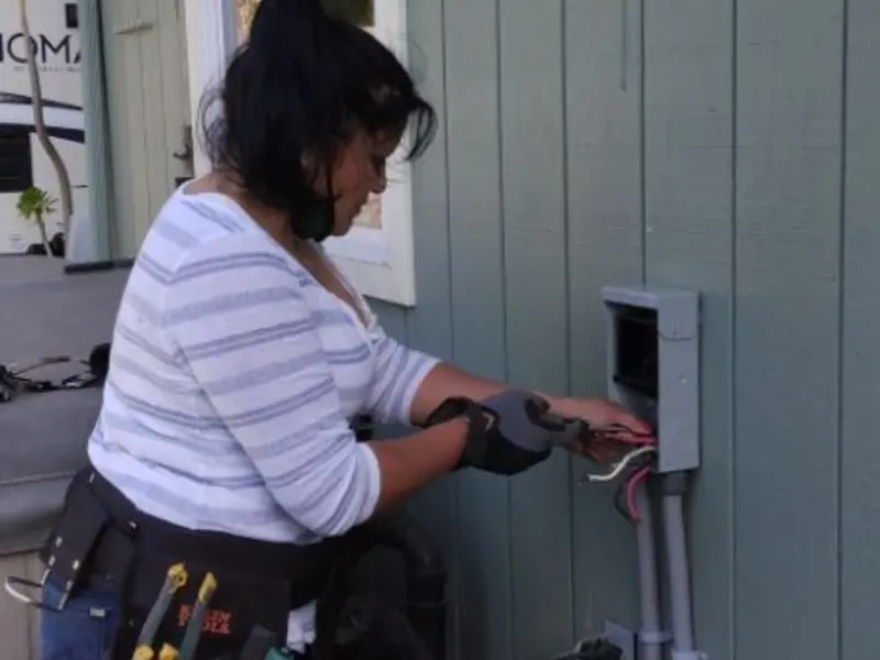Licensed electrician wiring an exterior subpanel in Nyack